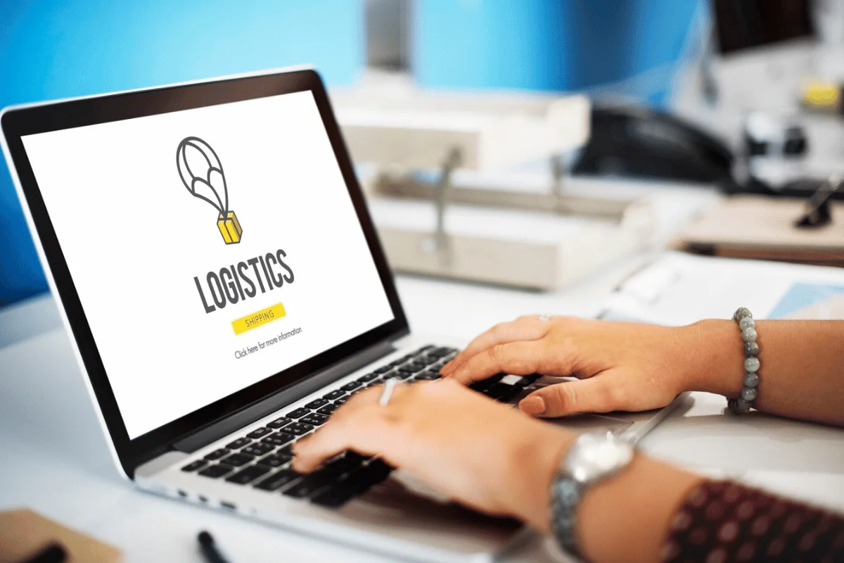 Close-up of a laptop screen filled with the word "logistics," highlighting its significance in supply chain management.
