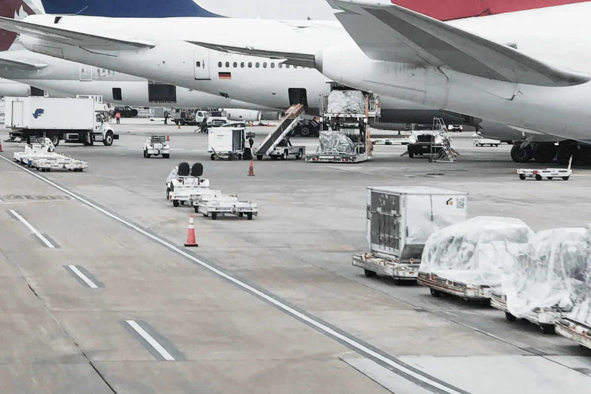Air cargo being loaded onto planes at an international airport.