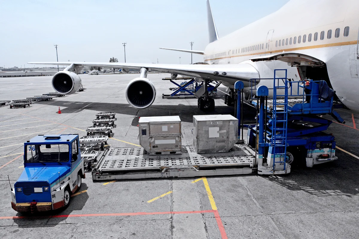 Shipping from Thailand to the USA: Challenges, Solutions & More 8 Freight containers being loaded into a plane for air transport.