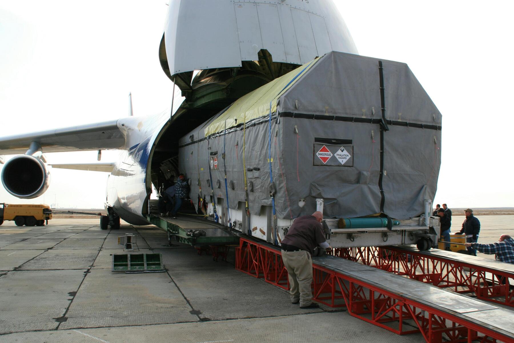 Cargo being loaded on the belly of a cargo plane.