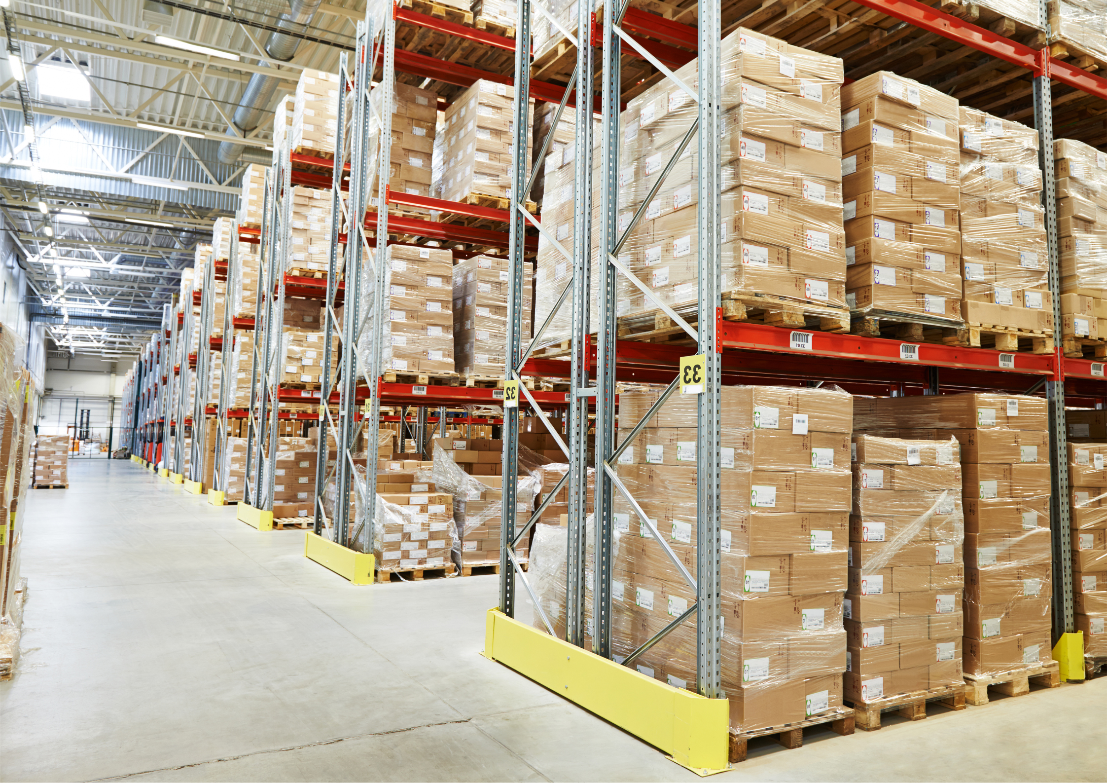 Digital freight forwarding and warehousing facility with stacked pallets and organized inventory storage racks.
